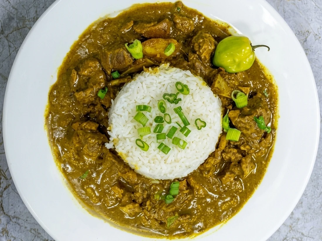 Curry goat at Twin Dem Kitchen London Ontario - tender Jamaican curry goat with island spices